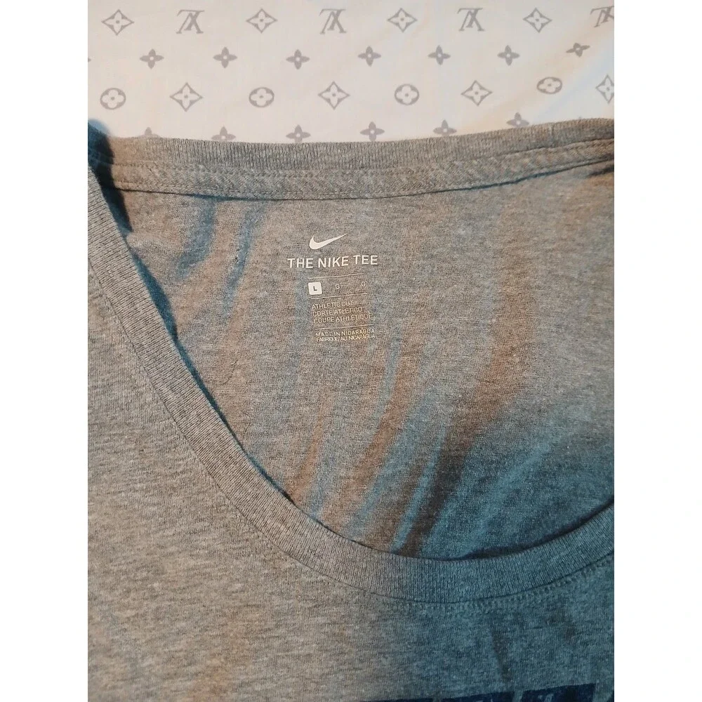 The Nike Tee Athletic Cut T-shirt Blue Metallic Logo L Women’s Color Gray